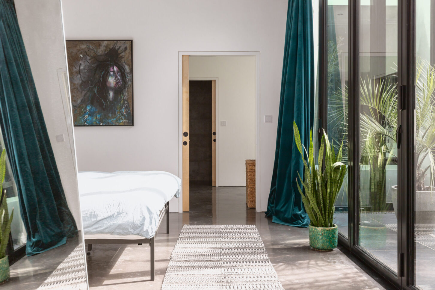 Bedroom hallway with framed artwork — Melrose Road, London