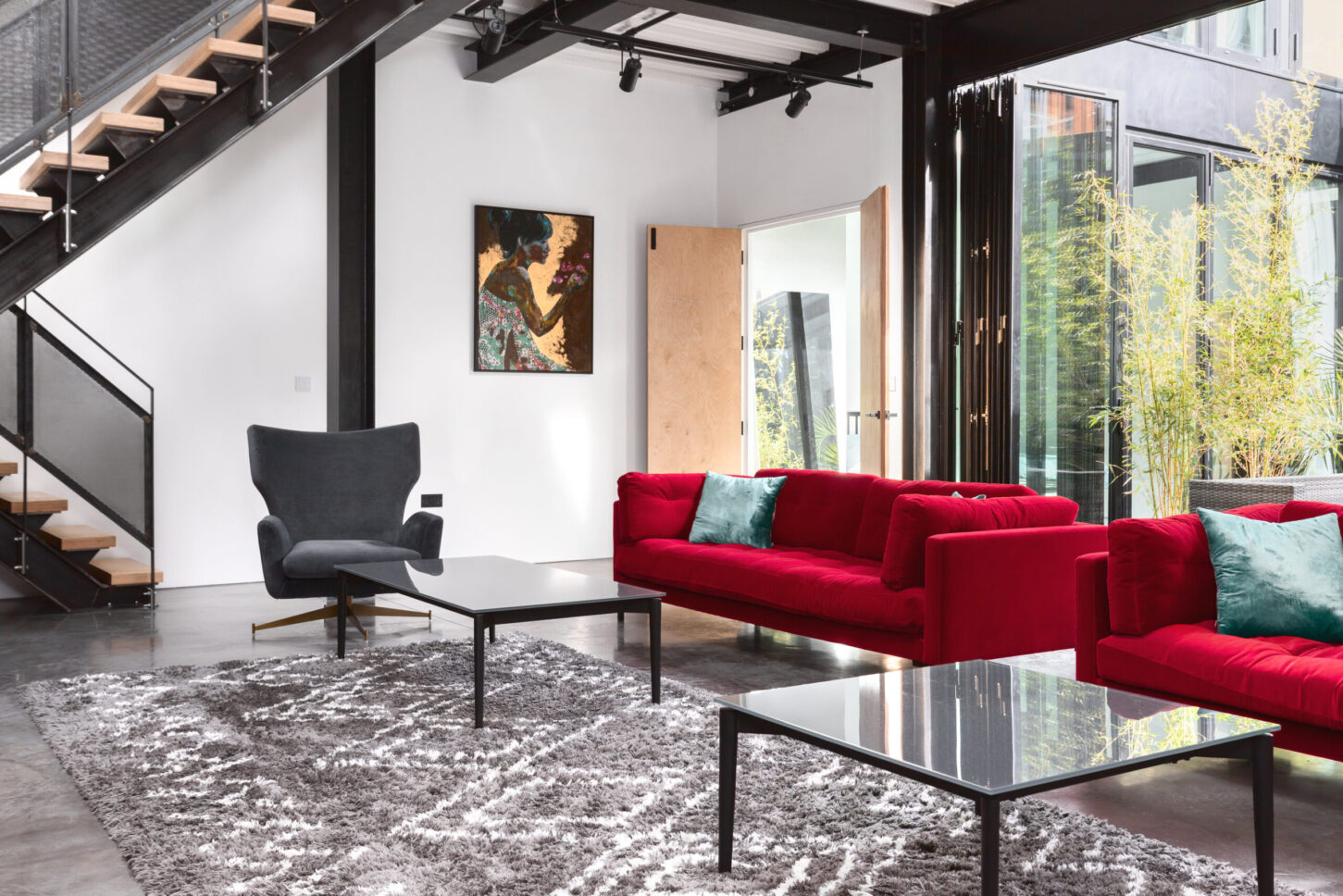 Modern living room interior with red accent chairs — Melrose Road, London
