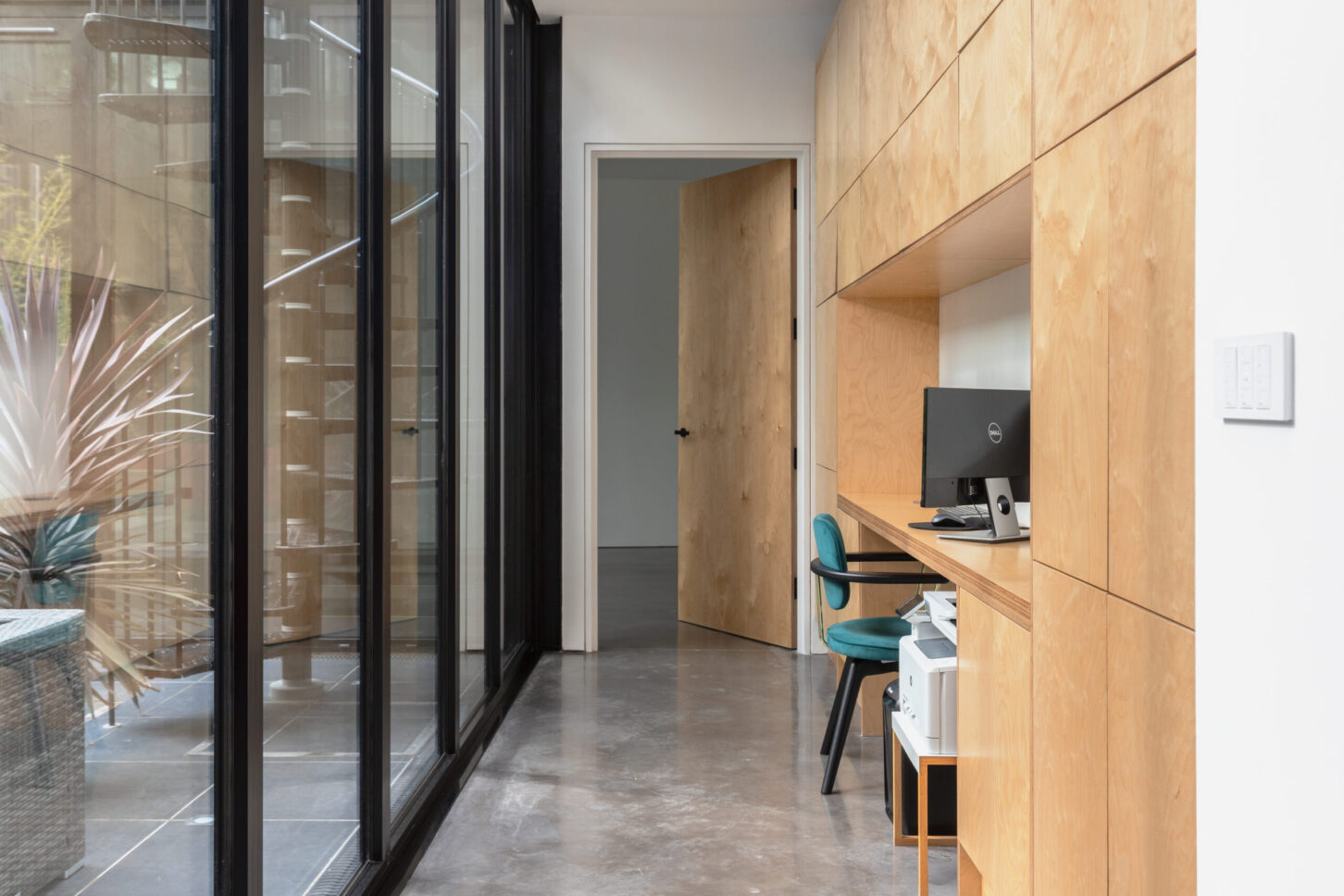 Wood-panelled corridor with glass partition — Melrose Road, London