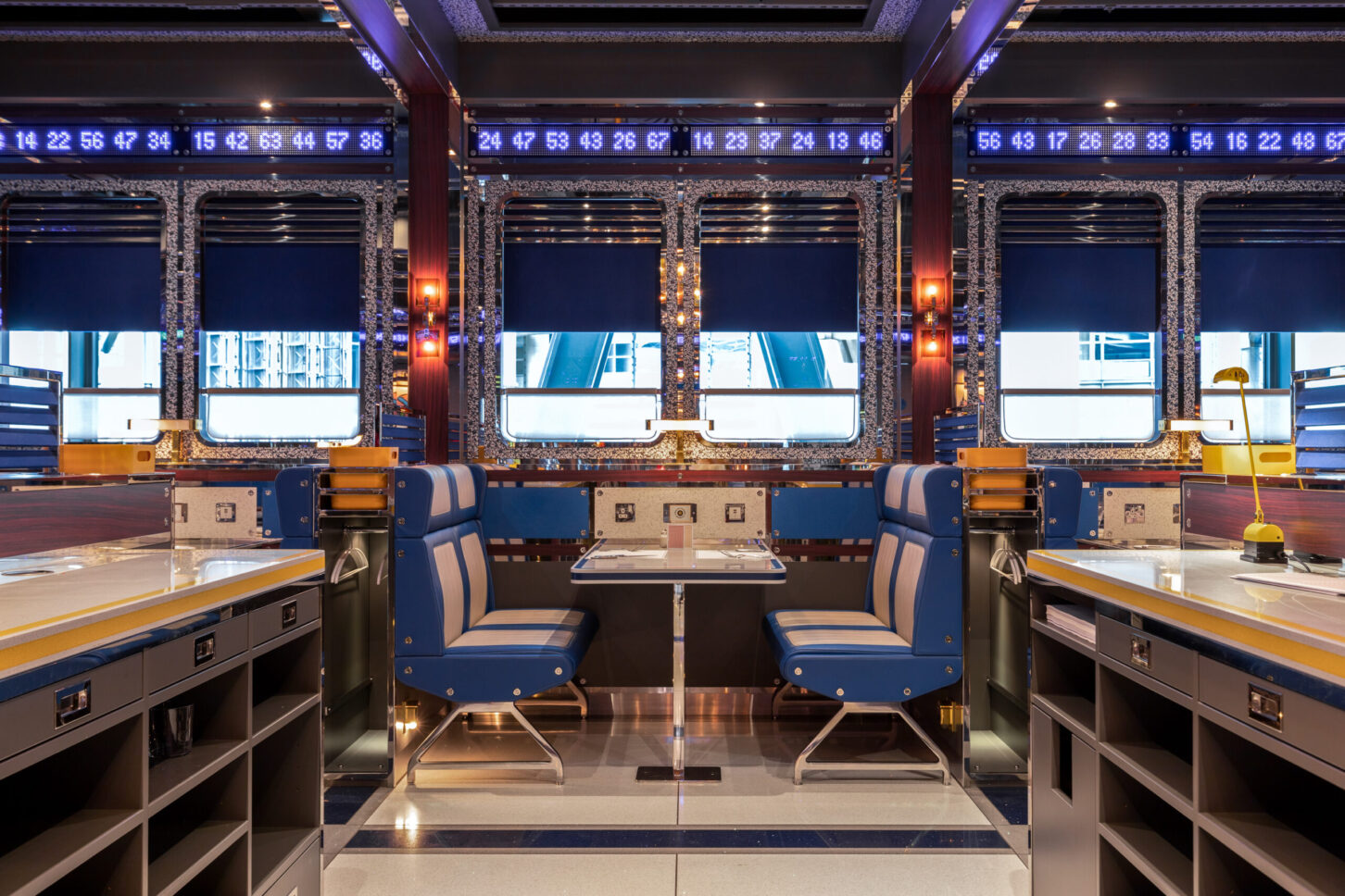 Booth seating with LED ticker displays and city skyline view — Bob Bob Ricard City, restaurant photographer London