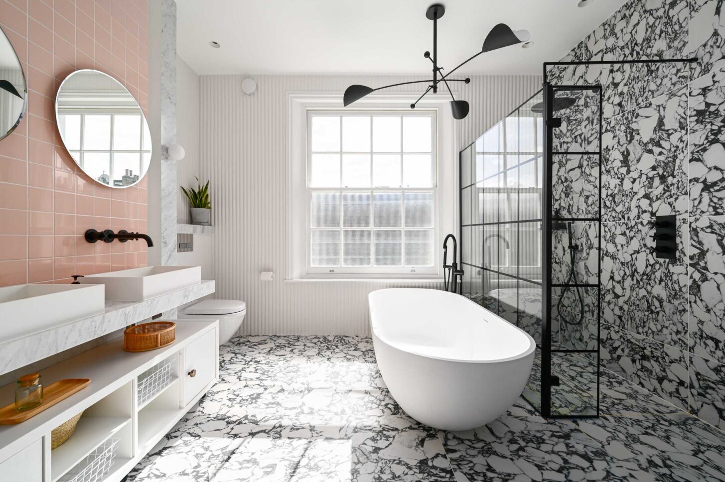 White bathroom with freestanding bathtub — designed by Sara Leonor Studio, London