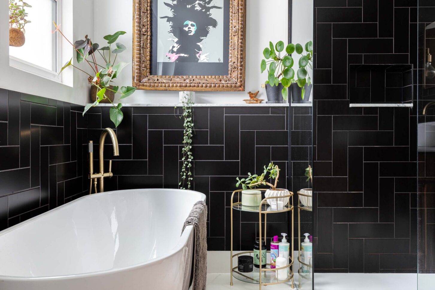 Bathroom with black tiled walls and freestanding bathtub — Claremond, designed by Architecture:WK, London