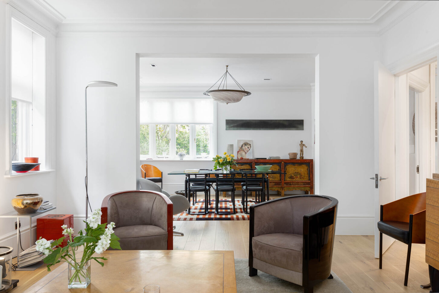 Living and dining room with art deco armchairs and antique sideboard — Hoban Design, Wimbledon