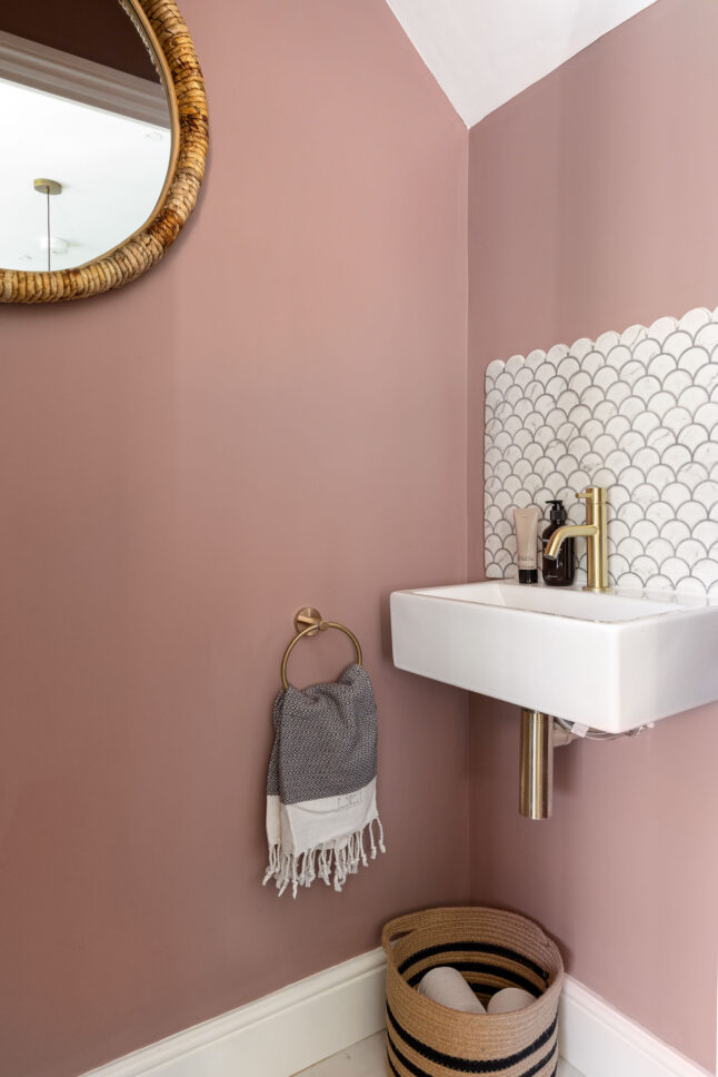 Pink powder room with scalloped tile splashback — interior photographer London, Blue + Green Interiors