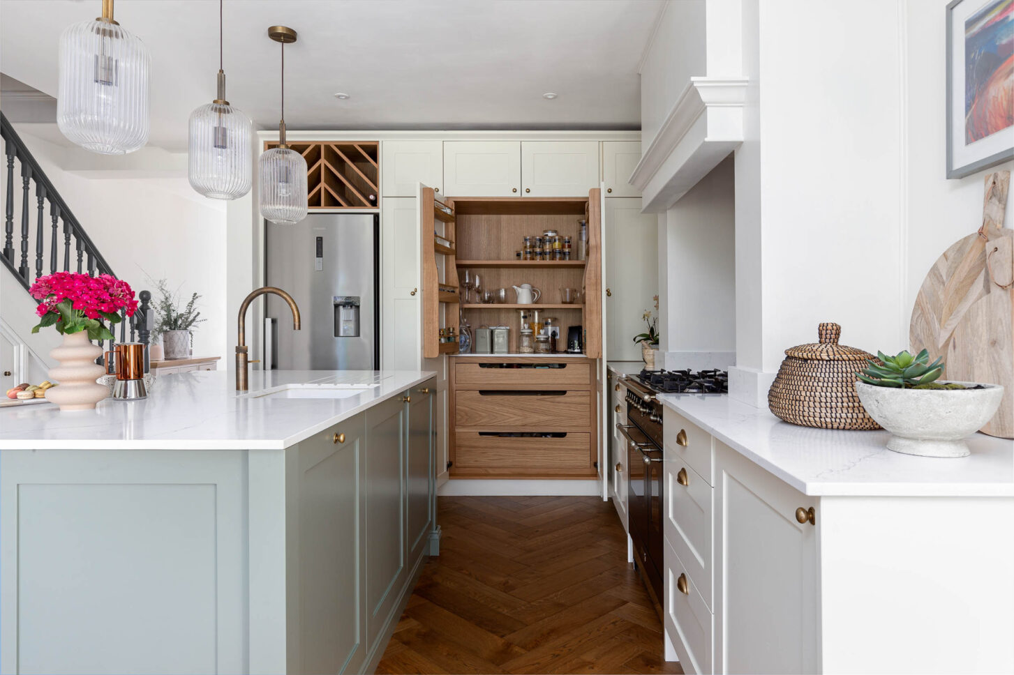 Kitchen with open pantry storage and herringbone flooring — interior photographer London, Blue + Green Interiors