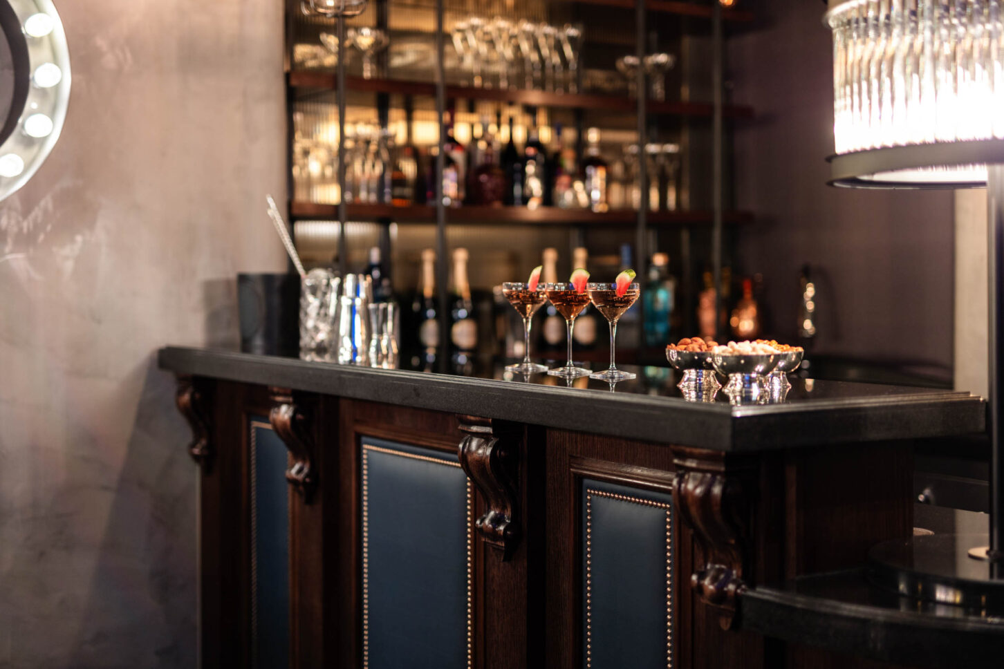 Dark wood cocktail bar with cocktails and glassware — restaurant photographer London, private members' restaurant