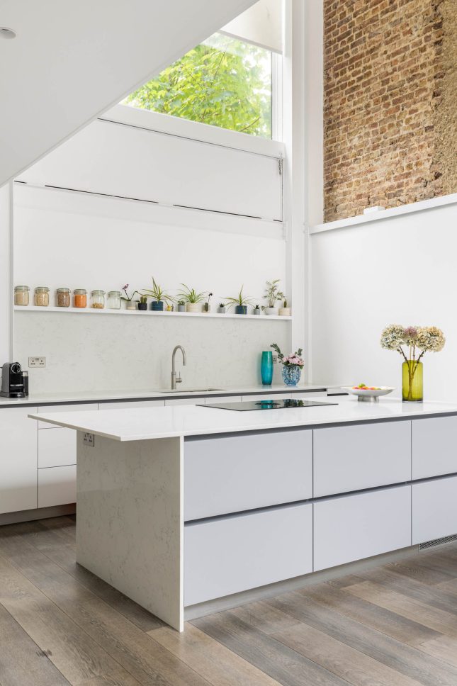 Kitchen island with exposed brick wall and open shelving — Canonbury, designed by Unknown Makers, London