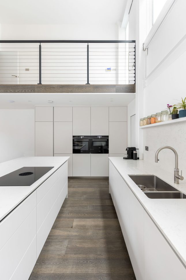 White minimalist kitchen with island unit — Canonbury, designed by Unknown Makers, London