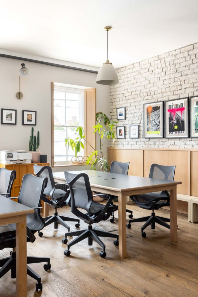Office desks with printer station and art-filled brick wall, designed by Unknown Makers — Kingsland project, London