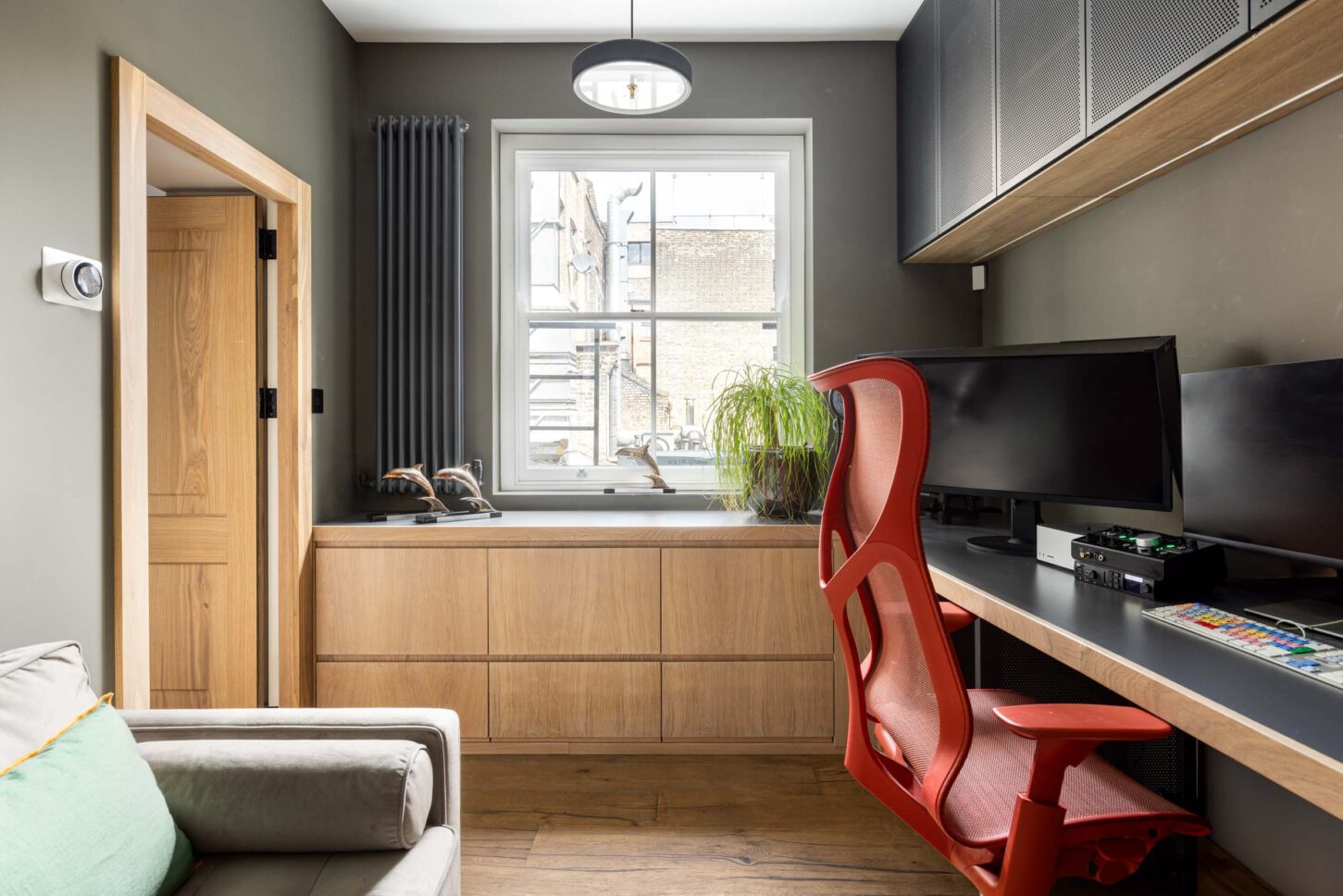 Office workstation with built-in desk and dual monitors, designed by Unknown Makers — Kingsland project, London