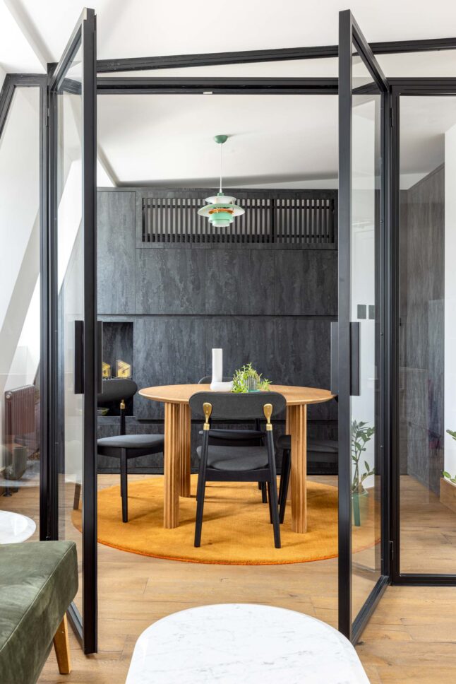 Office meeting room with glass partition walls and dark panelling — Kingsland, designed by Unknown Makers, London