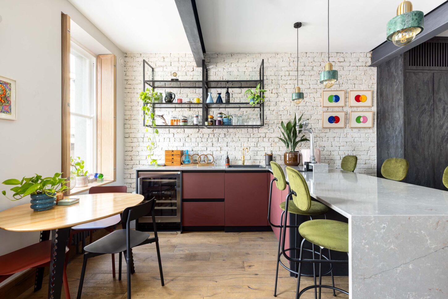 Office kitchen with exposed brick wall and colourful bar stools — Kingsland, designed by Unknown Makers, London