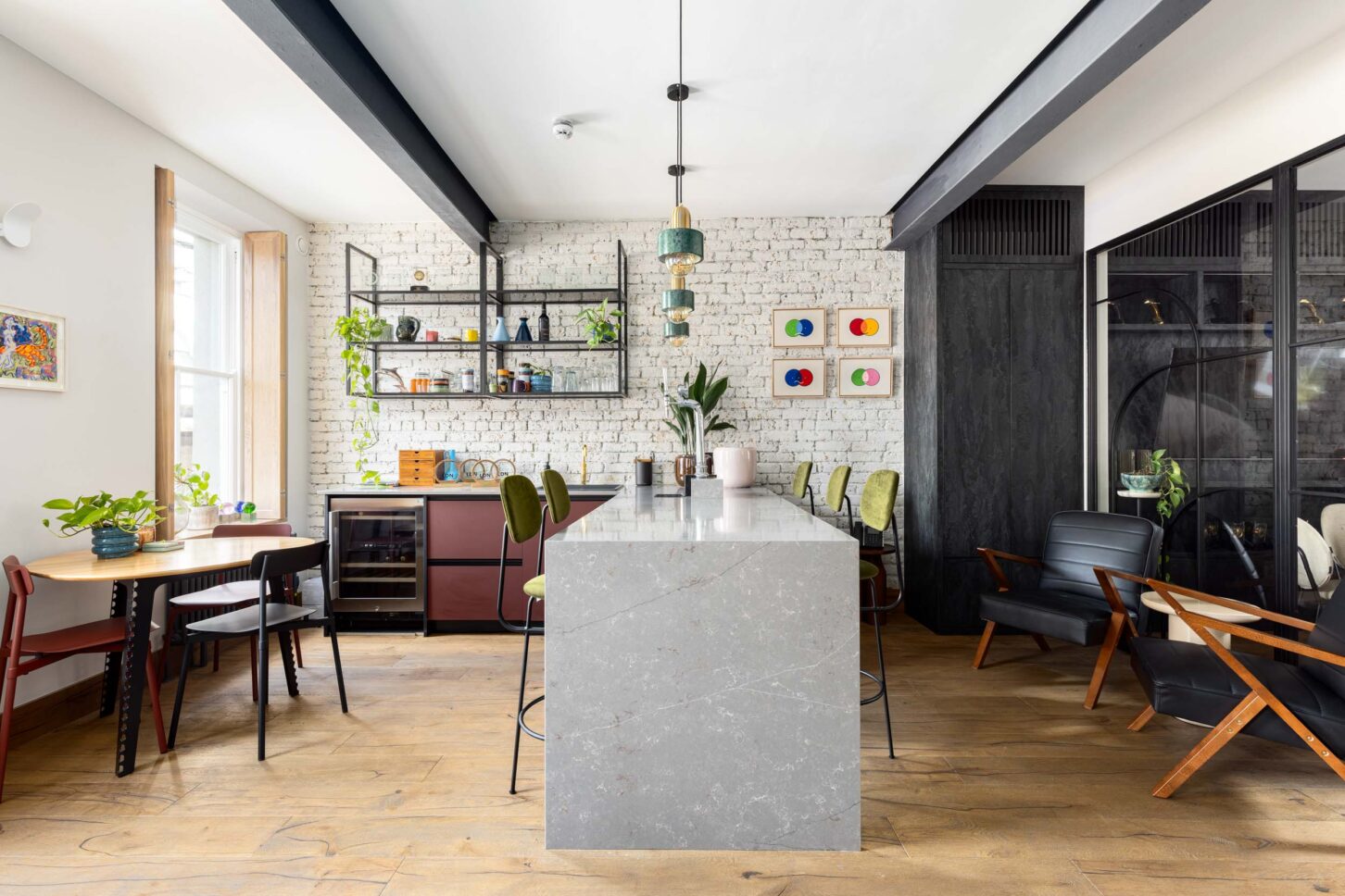 Office breakout kitchen with marble island and brick wall, designed by Unknown Makers — Kingsland project, London