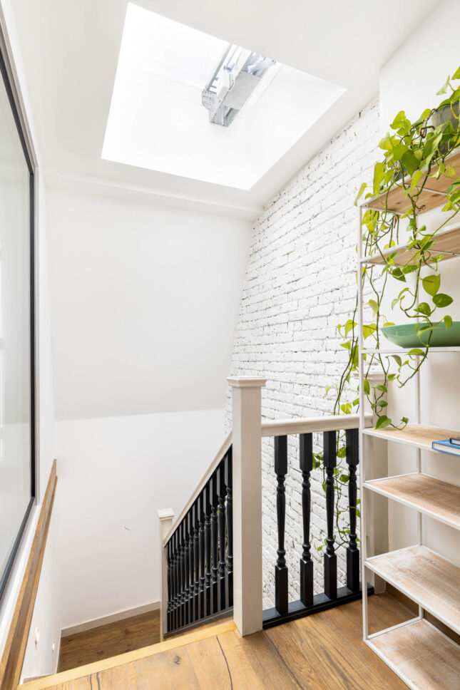 Office staircase with skylight and exposed brick wall, designed by Unknown Makers — Kingsland project, London