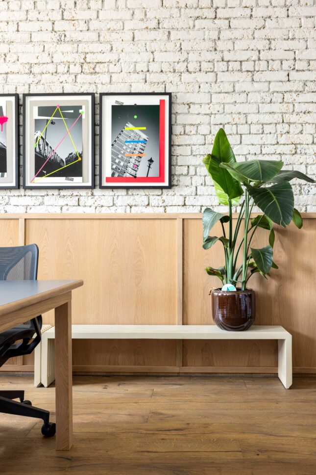 Office interior with framed artwork and wood panelling — Kingsland, designed by Unknown Makers, London